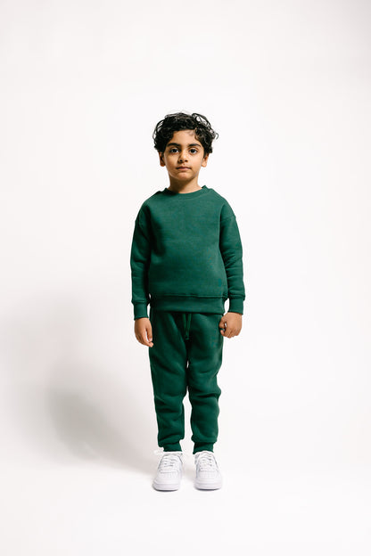 Unisex Kinder-Jogginghose in Bottle Green mit Taschen für Style und Komfort!