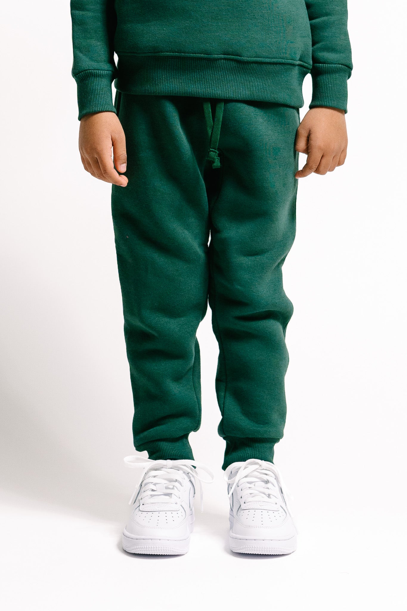 Unisex Kinder-Jogginghose in Bottle Green mit Taschen für Style und Komfort!